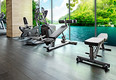 Empty gym room with group of exercise machine.