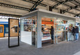 Den Bosch, The Netherlands - February 01, 2018: Customers buying drinks and sweets at kiosk in Den Bosch central train station